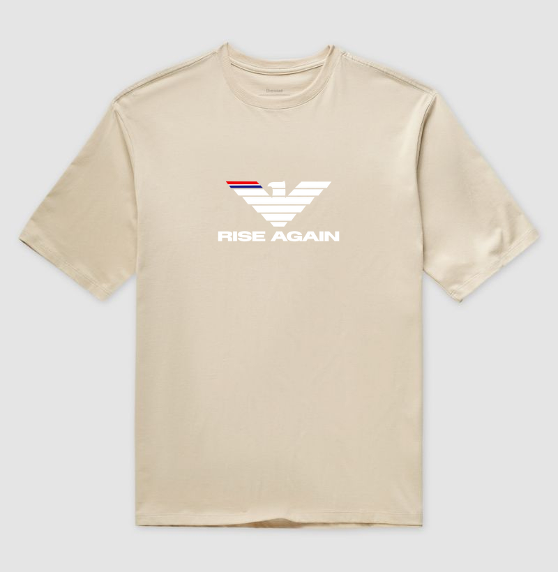 A estampa "Rise Again" é a representação visual da força de quem nunca desiste. Com uma águia estilizada de traços marcantes e design moderno, a arte simboliza poder, foco e a capacidade de se reerguer mais forte após cada batalha. - Imagem 3