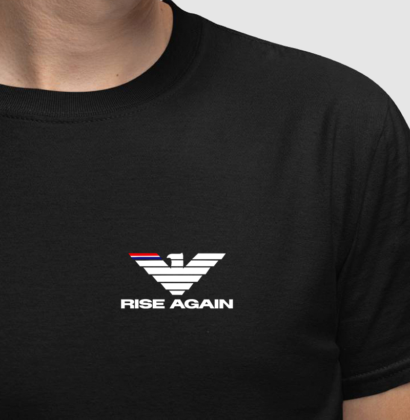 A estampa "Rise Again" é a representação visual da força de quem nunca desiste. Com uma águia estilizada de traços marcantes e design moderno, a arte simboliza poder, foco e a capacidade de se reerguer mais forte após cada batalha. - Camiseta